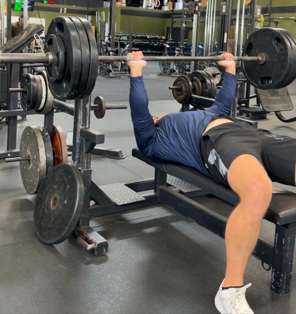 Athlete benching to improve strength
